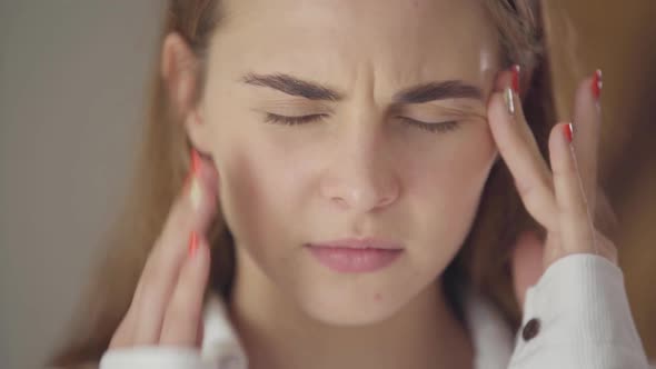Portrait of Confident Carefree Cute Woman with Different Colored Eyes Looking at Camera alt