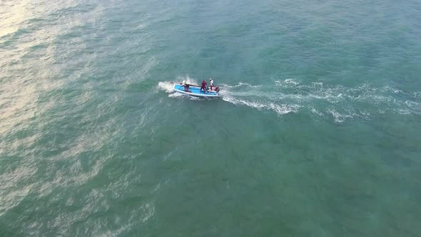 Aerial view of traditional fishing boat driving in the sea of Rio do Fogo. alt