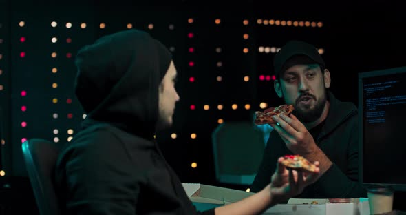 A Group Hackers Organize an Attack on Data Servers Their Hideout is Dark and Full alt