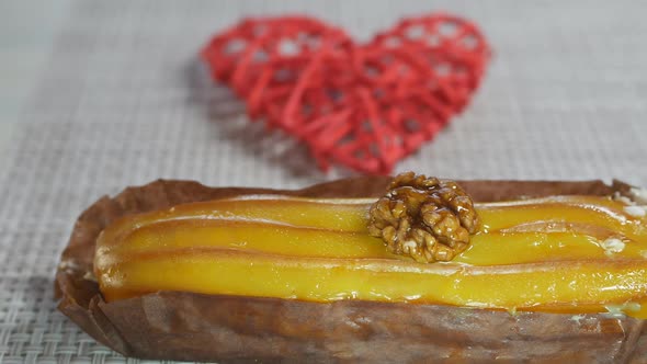 Yellow Eclair with Banana and Passionfruit Flavor with Custard Inside