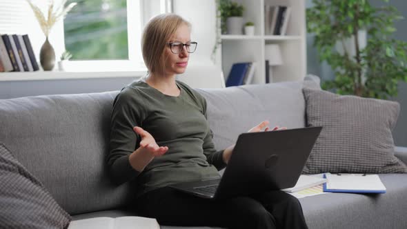 Woman Having Conference on Laptop