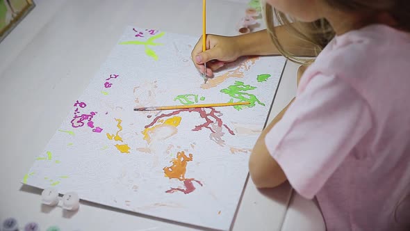 Child Paints at the Table