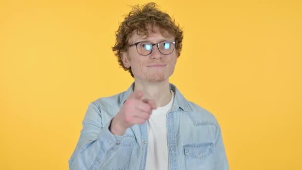 Call Me Gesture By Redhead Young Man Yellow Background alt
