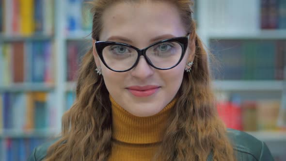 Portrait Close Up of Happy Pretty Young Woman, Girl in Glasses Student Smiling Looking in the Camera alt