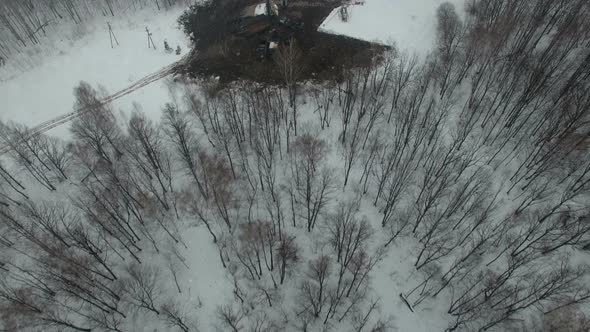 Drilling a Deep Well with a Drilling Rig Oil and Gas Field in Winter Forest. Field Located in