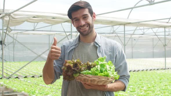 Young hispanic businessman farmer with  good quality product selling plant and vegetable.