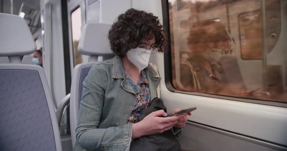 Woman travelling on the train during coronavirus pandemic