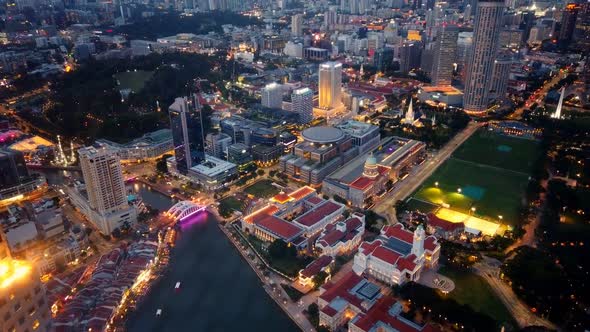 Time Lapse of Day To Night View of Singapore City. Skyline From Aerial View.