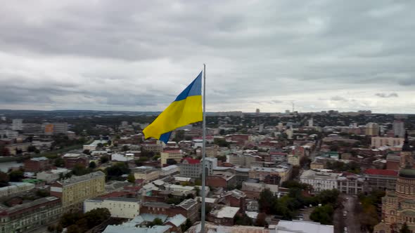 Flag of Ukraine wave, Kharkiv city downtown aerial