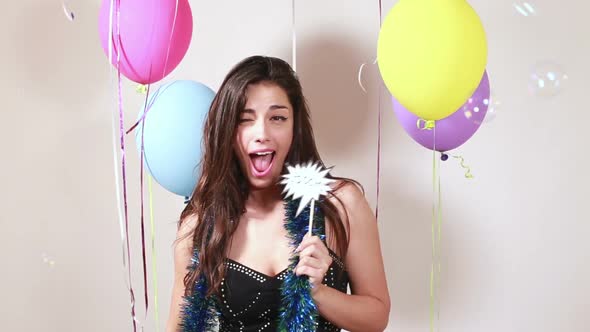 Sexy brunette woman in party photo booth alt