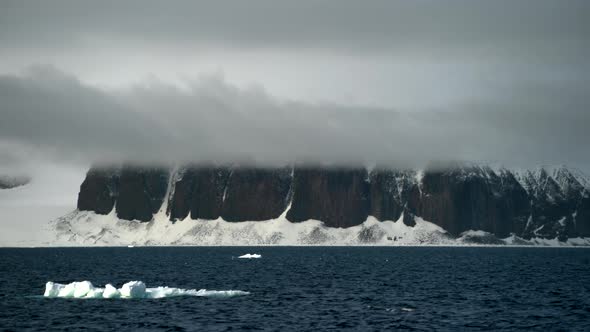 Ice Floats, Beautiful Rocks in the Fog Behind