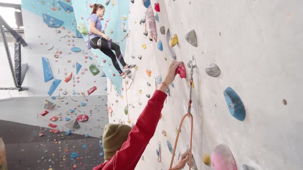 Two Climbers Practicing in Gym alt