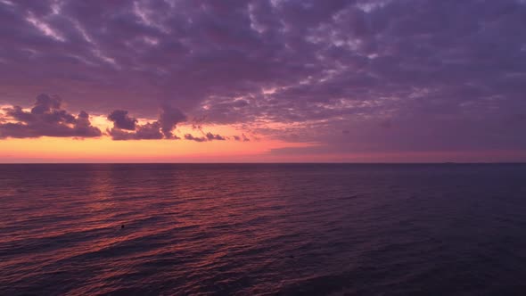 Purple Skies Over The Calm Sea At Sunset