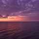 Purple Skies Over The Calm Sea At Sunset - VideoHive Item for Sale