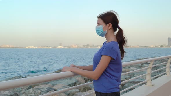 Girl in Medical Mask with Sea View 