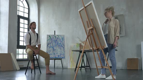 Artist Woman Drawing Man Portrait in The Studio