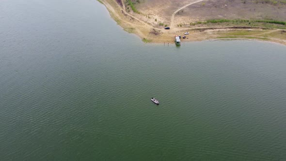 Boat fishing on Falcon Lake then view towards Los Lobos community. alt