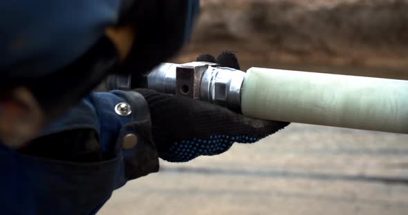 Close Up Footage of Two Men Connecting Pipes Together Breaking the Spacers alt