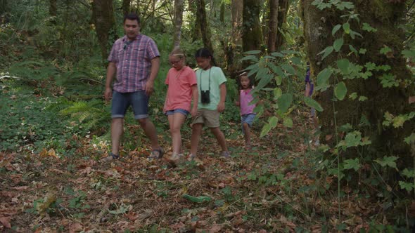 Kids at summer camp going on a nature hike