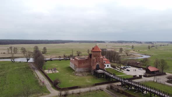 Aerial View of Brick Old Tower with Flag