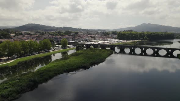 Roman Bridge over Lima River on Scenic landscape of Ponte de lima, Portugal, Aerial View