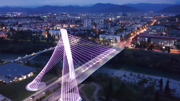 Podgorica Montenegro at night, featuring illuminated cable-stayed Millennium bridge alt