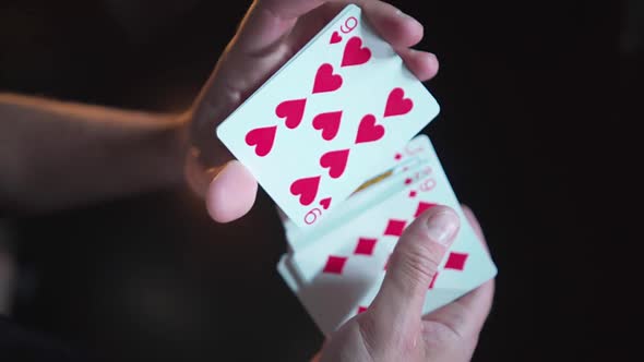 Close-up. Slow motion. Men's hands mix a deck of cards. Gambling Top view alt