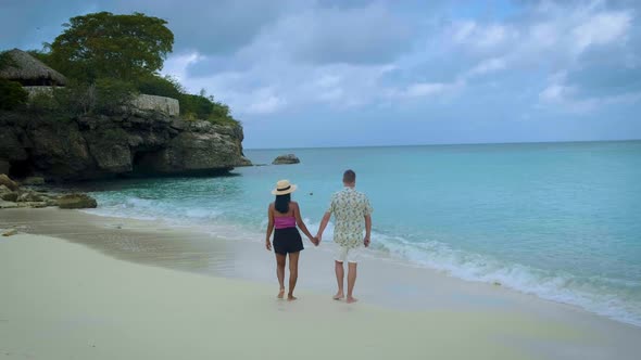 Couple Men and Woman Mid Age on the Beach of Curacao Grote Knip Beach Curacao Dutch Antilles alt