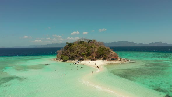 Small Torpic Island with a White Sandy Beach Top View alt