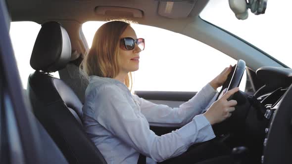 Woman Driving and Listening Music