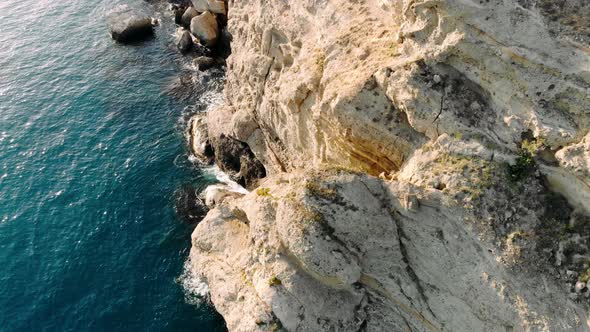 Aerial Drone View of Sea Waves Breaking on Rocks at Shore alt