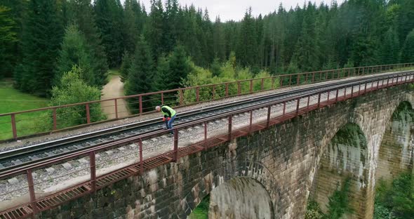 Aerial Shot Construction Worker on Railways alt