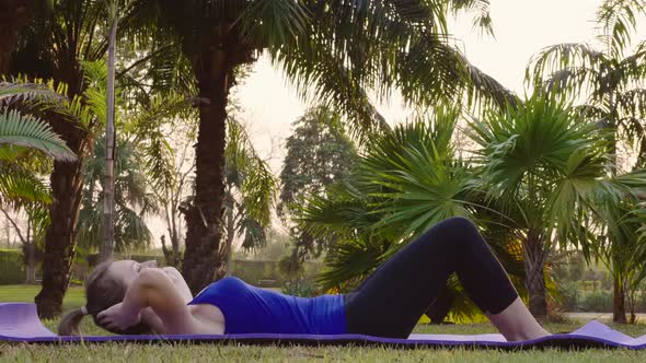 Woman Start Abdominal Press Exercises on Sports Mat Laughing and Fun alt