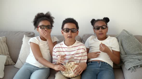 Cute Children in 3d Glasses Watching Movie on Couch alt