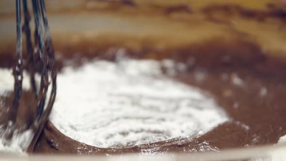 Stirring Of Flour And Melted Chocolate Mixture With Whisk In Slow Motion