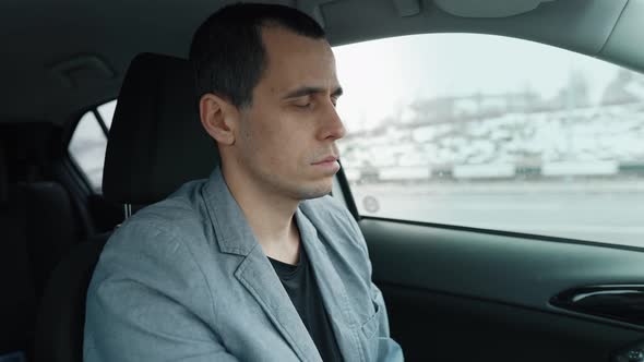 Man Falls Asleep While Driving a Car