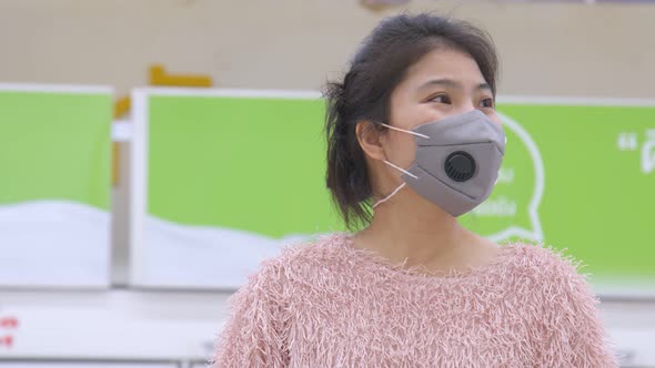 New normal lifestyle Asian mature adult female woman shopping in supermarket alt