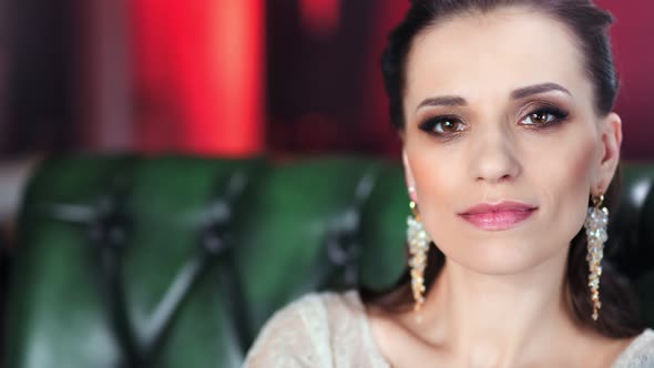 Tilt Up Portrait Beautiful Smiling Fashion Girl with Evening Makeup Lifting Head Looking at Camera alt