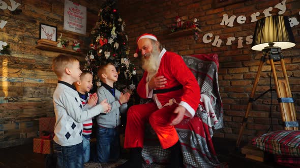  Three Young Boys Tell Santa Claus Funny Stories in Decorated in Festive Room