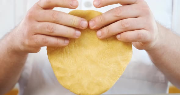 Kneading Mashing Dough Chef Crumples with Hands Round Piece to Cook Pasta