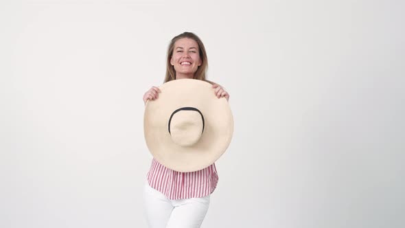 Woman Posing with Large Hat