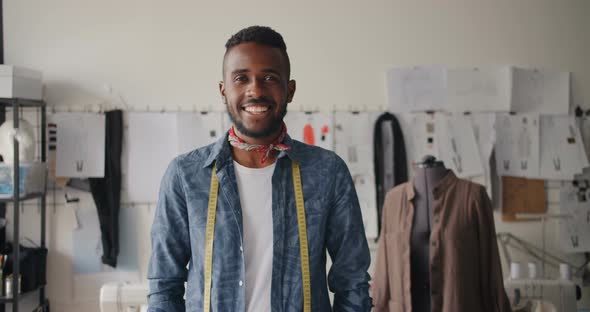 Portrait of Creative Young Tailor African American Man Smiling in Studio alt