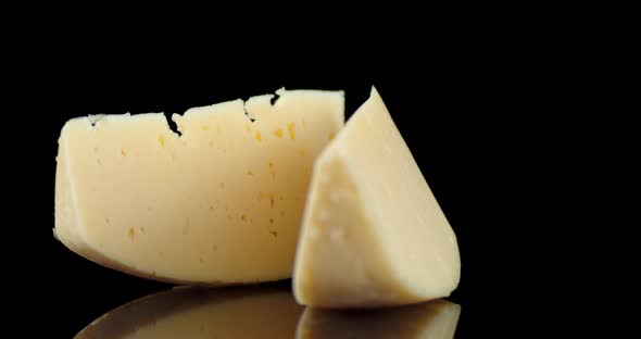 The Pieces of Cheese on the Table Slowly Rotating alt