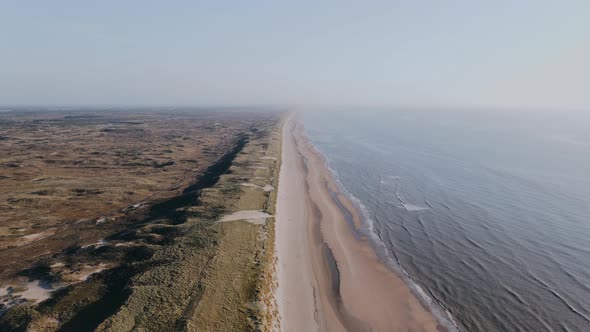 Drone Flies Over Long Ocean Shore in the Wilderness on a Summer Day