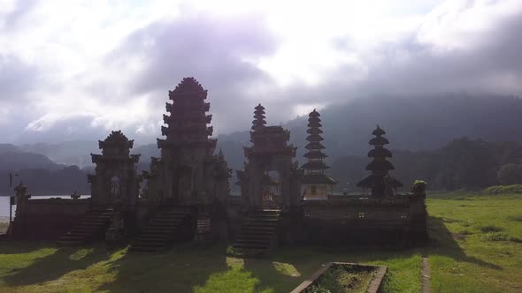 Traditional Balinese Temple - Pura Ulun Danu Tamblingan. Aerial Cinematic Travel Footage. Bali alt