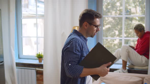 Cheerful Successful Hipster Guy Walking and Dancing in College Dormitory alt