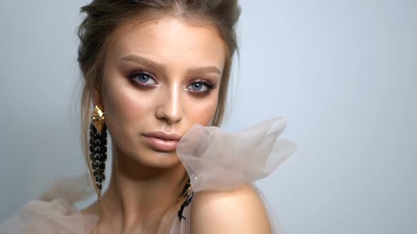 Beauty Portrait of Model Face with Bright Blue Eyes Skin Care Concept.