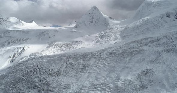 Aerial footage of drone flying over fossil glacier in tibet, China alt