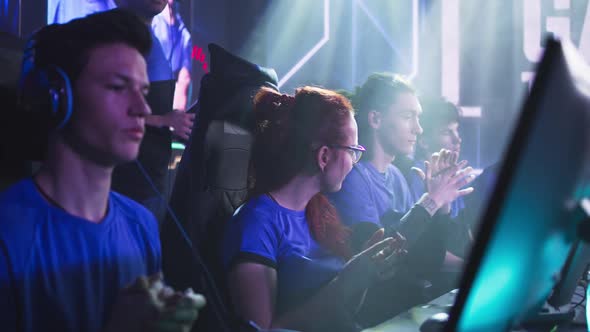 Nervous Female Gamer Preparing for Match with Team alt