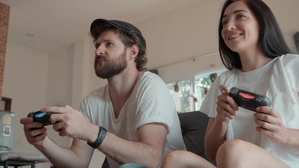 Man and Woman Playing Video Games at Home, Stock Footage | VideoHive